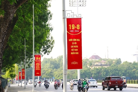 Red flags and banners color Hanoi on National Day