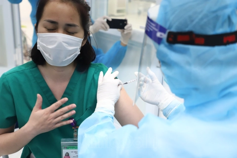 Close-up of first Covid-19 vaccination in Hanoi