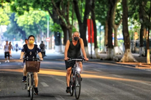 Hanoi relaxes social distancing, HCMC sees record-high infections 