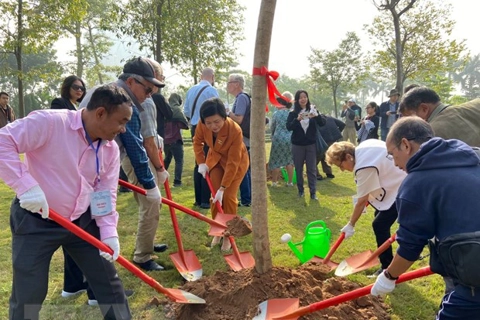 International delegates join tree-planting event to celebrate the Paris Peace Accords