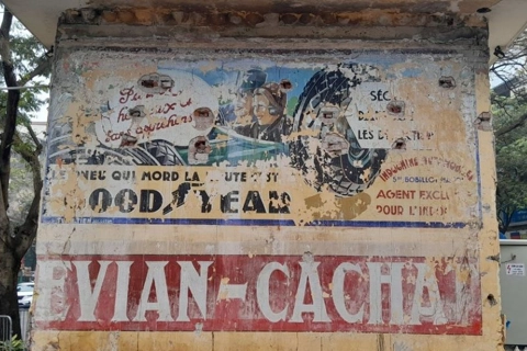 Colonial-era French ad posters preserved on Hanoi street