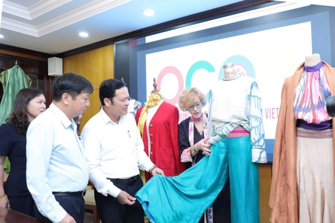European designer's silk outfit debuts at Hanoi festival