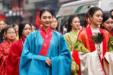 Lively celebration of Vietnamese traditional attire in Hanoi's Old Quarter