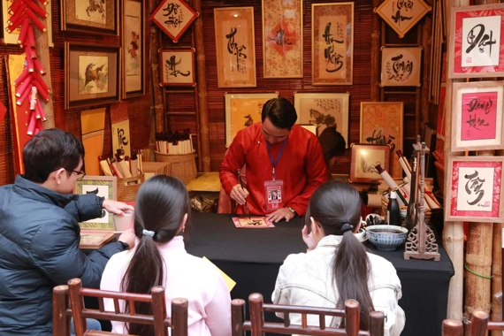 Red paper, rising hopes: Tet calligraphy lights up Hanoi